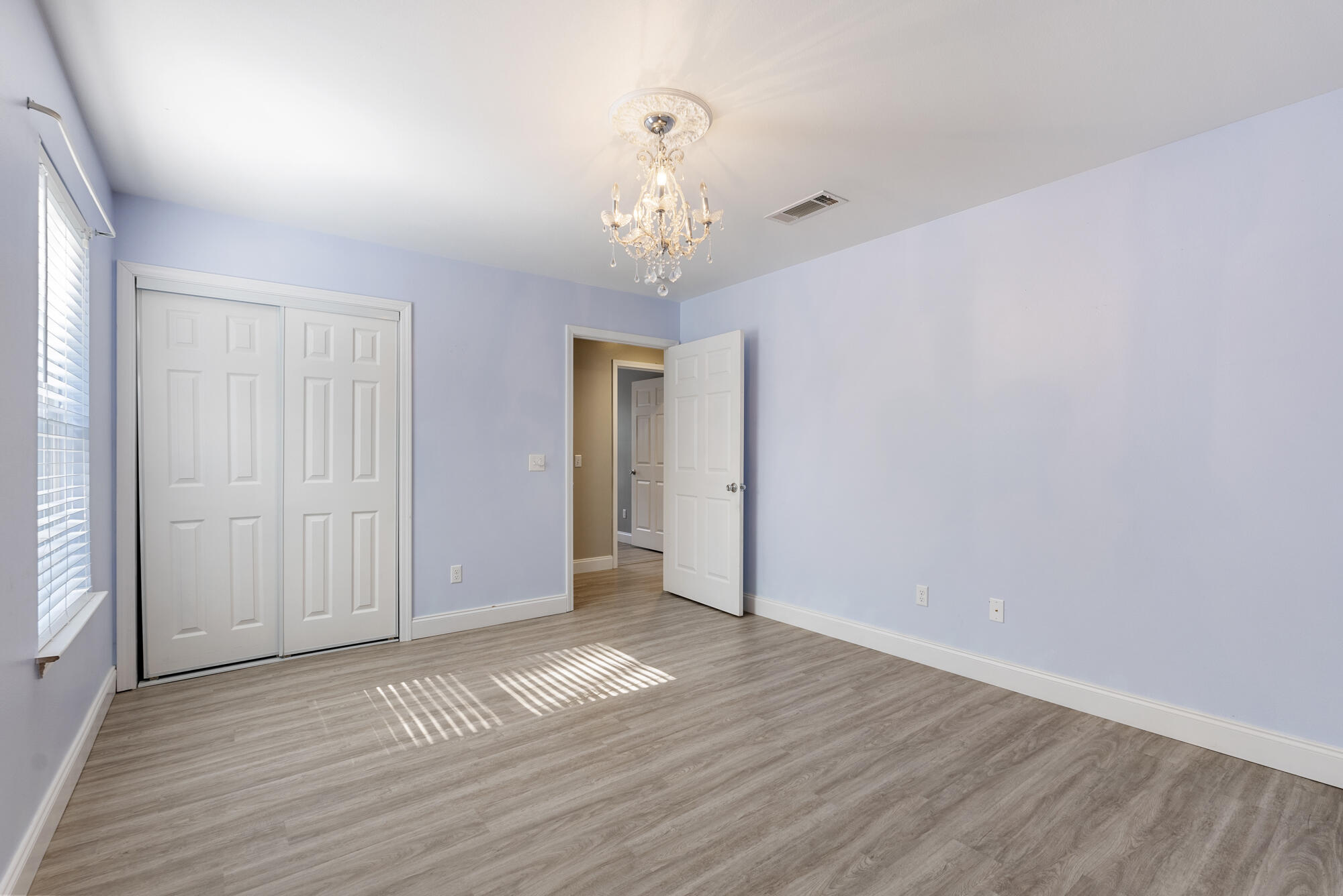 59 6th Street Santa Rosa Beach, FL 32459 - Photo 22 of 43 a view of an empty room with wooden floor