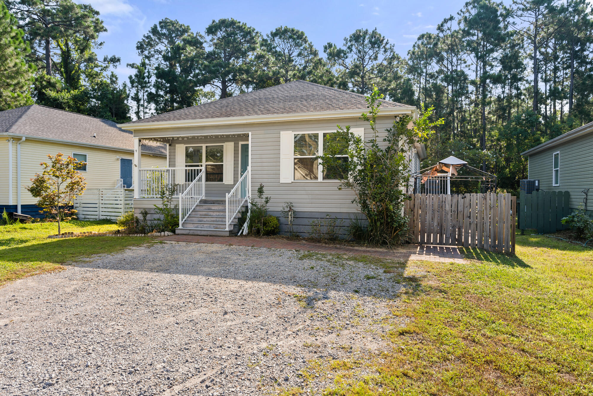 59 6th Street Santa Rosa Beach, FL 32459 - Photo 3 of 43 a house with swimming pool in front of it