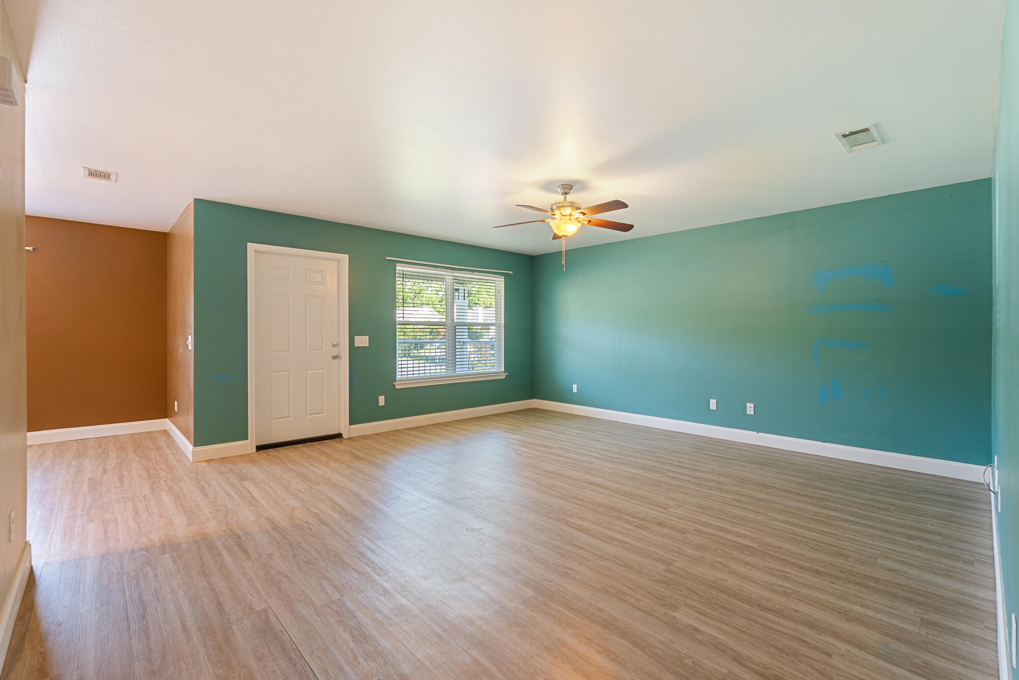 59 6th Street Santa Rosa Beach, FL 32459 - Photo 6 of 43 an empty room with wooden floor and windows