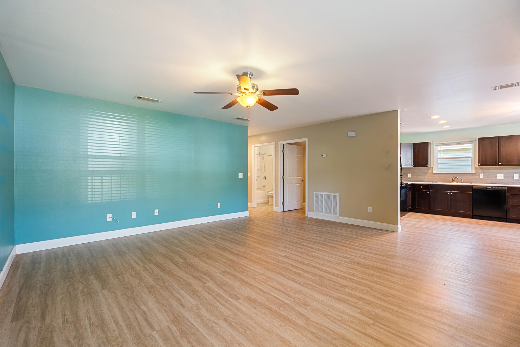 59 6th Street Santa Rosa Beach, FL 32459 - Photo 8 of 43 a view of an empty room with a window and wooden floor