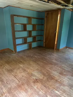 a front view of house with yard outdoor seating and barbeque oven