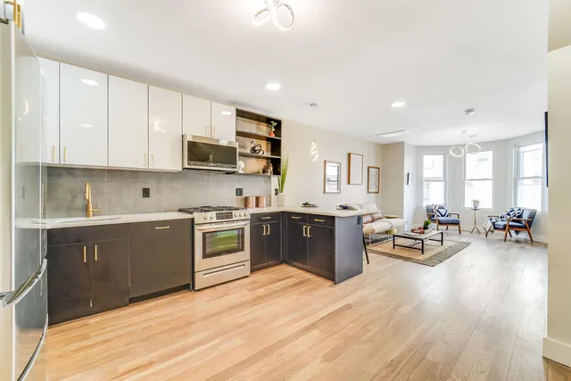 a bed room with a bed and a chair