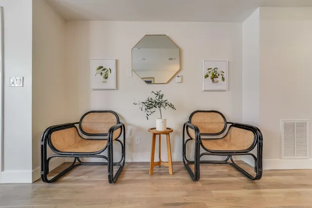 a view of a dining room with furniture and a window