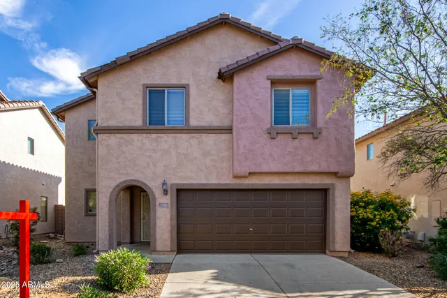 a living room with lots of furniture and a rug