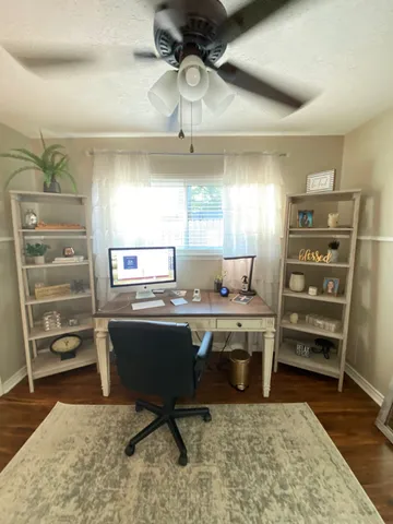 a view of a workspace with furniture