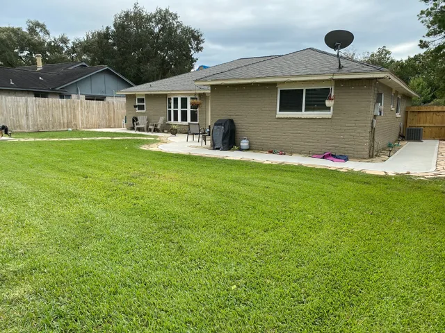 a front view of house with yard and outdoor seating