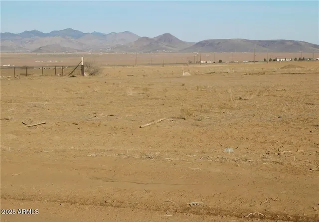 a view of an ocean with a mountain