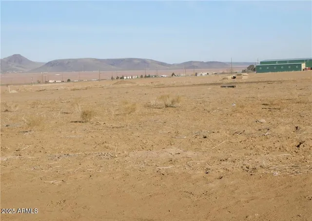 a view of an ocean with a mountain