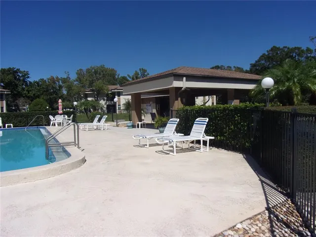 a backyard of a house with a garden and plants
