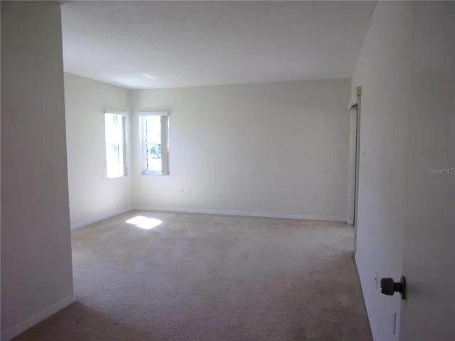 a view of empty room with windows