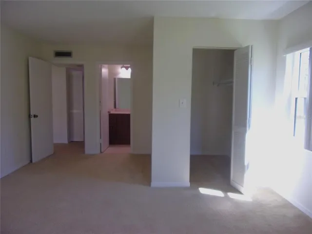 an empty room that has a bathroom