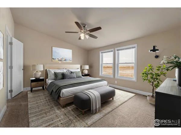 a spacious bedroom with a bed and a window