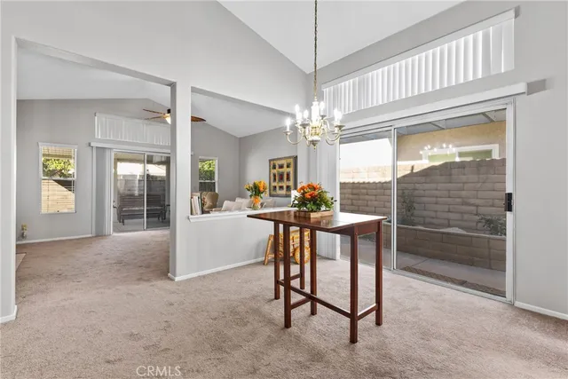 a view of dining room with furniture window and wooden floor