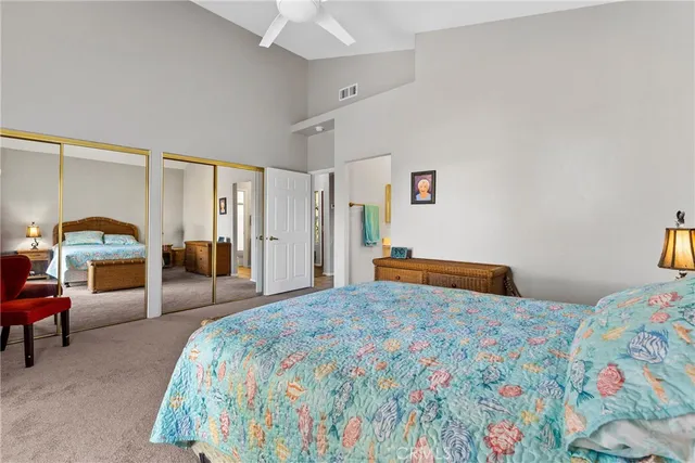 a bedroom with a bed and a couch