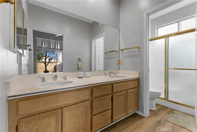 a bathroom with a sink double vanity and a mirror