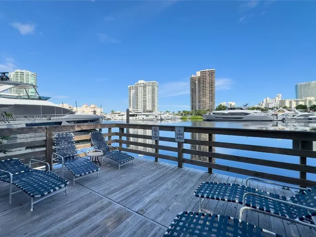 a view of a terrace with wooden benches