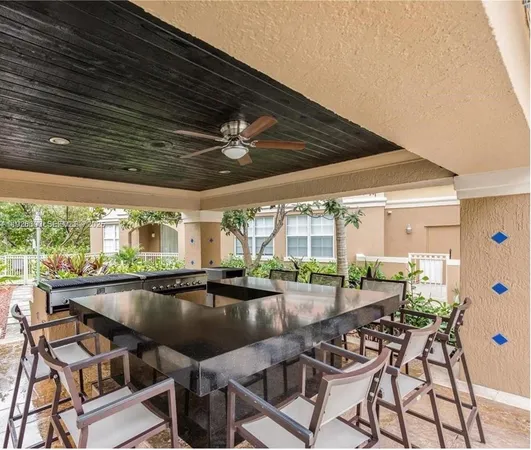 a swimming pool with outdoor seating and yard