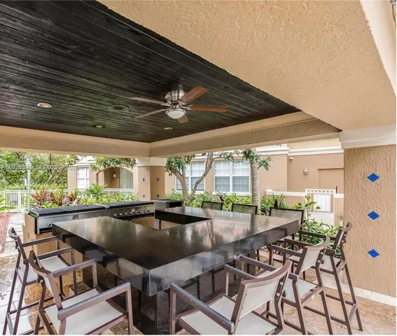 a swimming pool with outdoor seating and yard