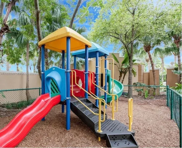 an outdoor space with furniture and umbrella