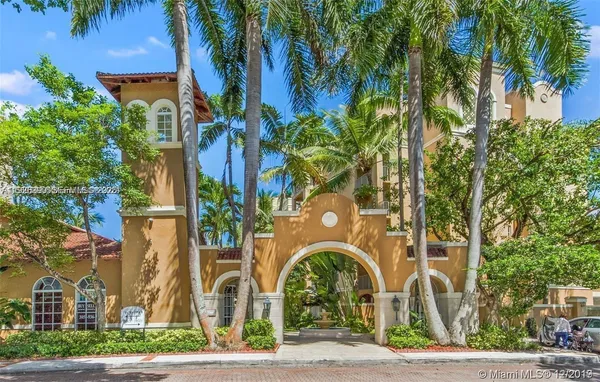 a front view of a building with garden