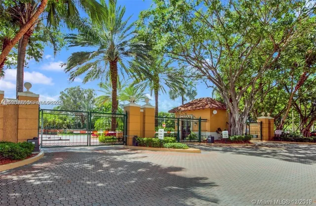 a building with palm trees in front of it