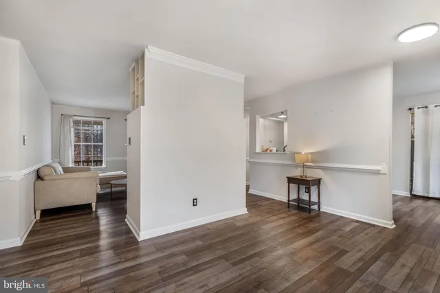 a view of kitchen with furniture and wooden floor