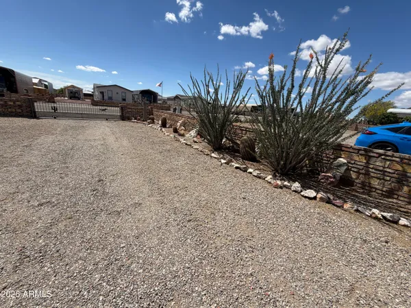 a view of a livingroom with furniture windows and dinning area