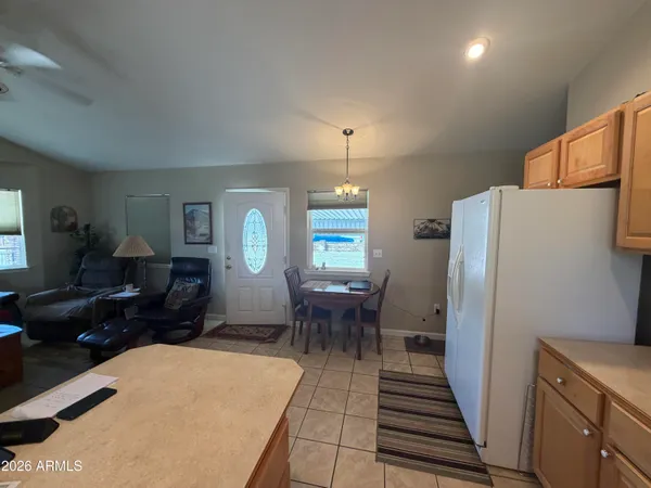 a kitchen with a sink a counter top space stainless steel appliances and cabinets
