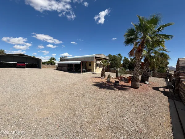 a view of outdoor space with palm trees