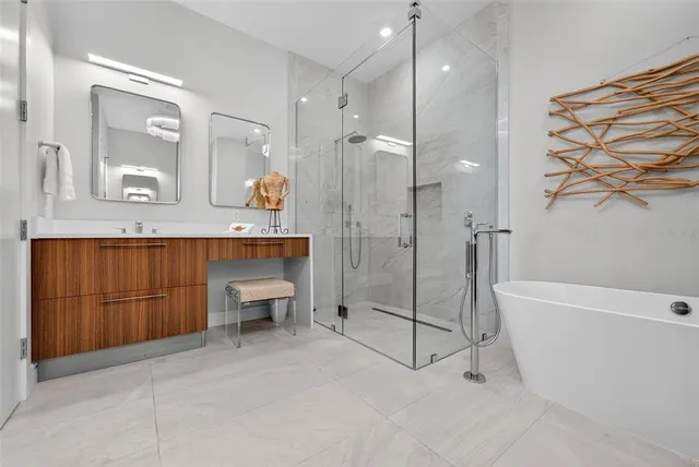 a bathroom with a bathtub and a shower