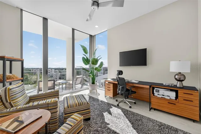 a bedroom with a bed and glass walk in closet