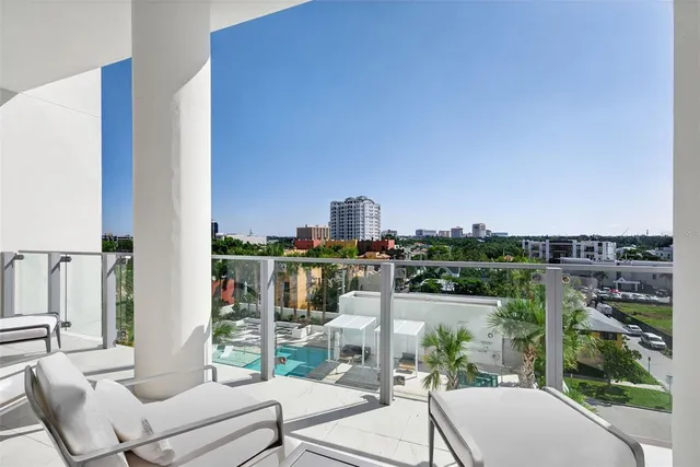 a bathroom with a shower sink and mirror