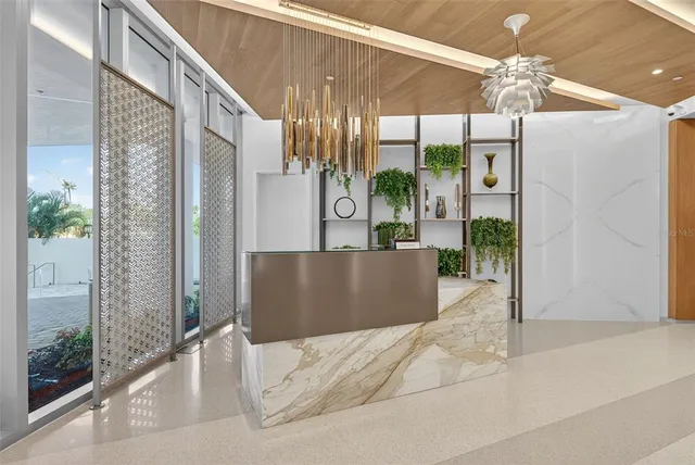 a kitchen with a table chairs and white cabinets