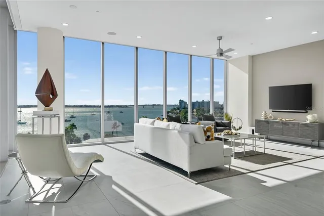 a living room with fireplace furniture and a flat screen tv