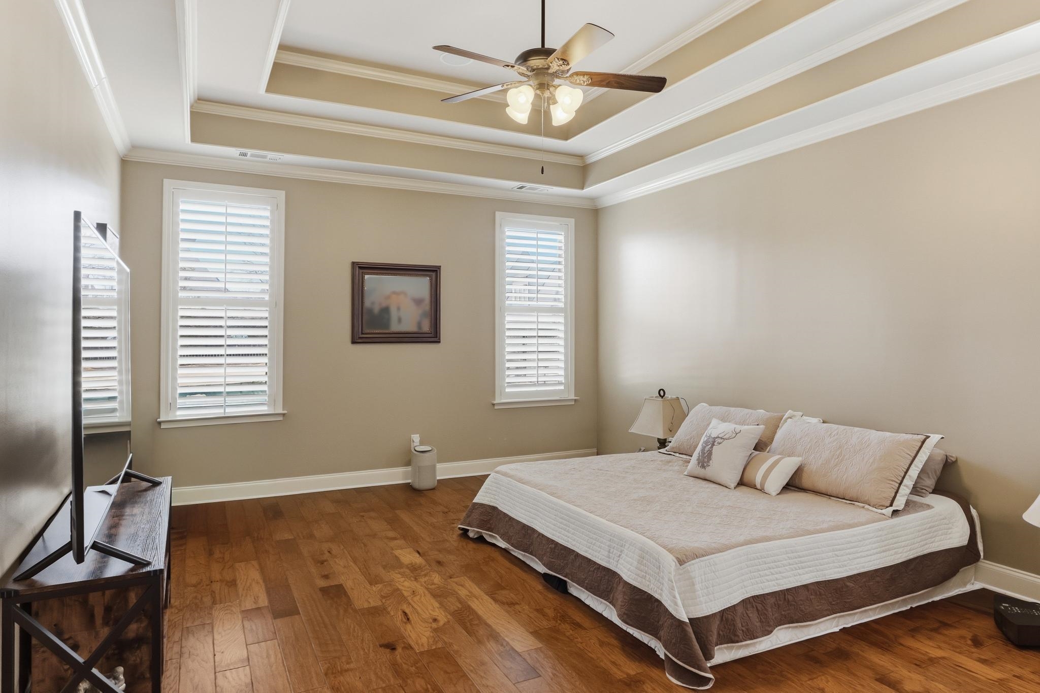 1301 Conser Street Collierville, TN 38017 - Photo 16 of 40 a bedroom with a bed and a chandelier