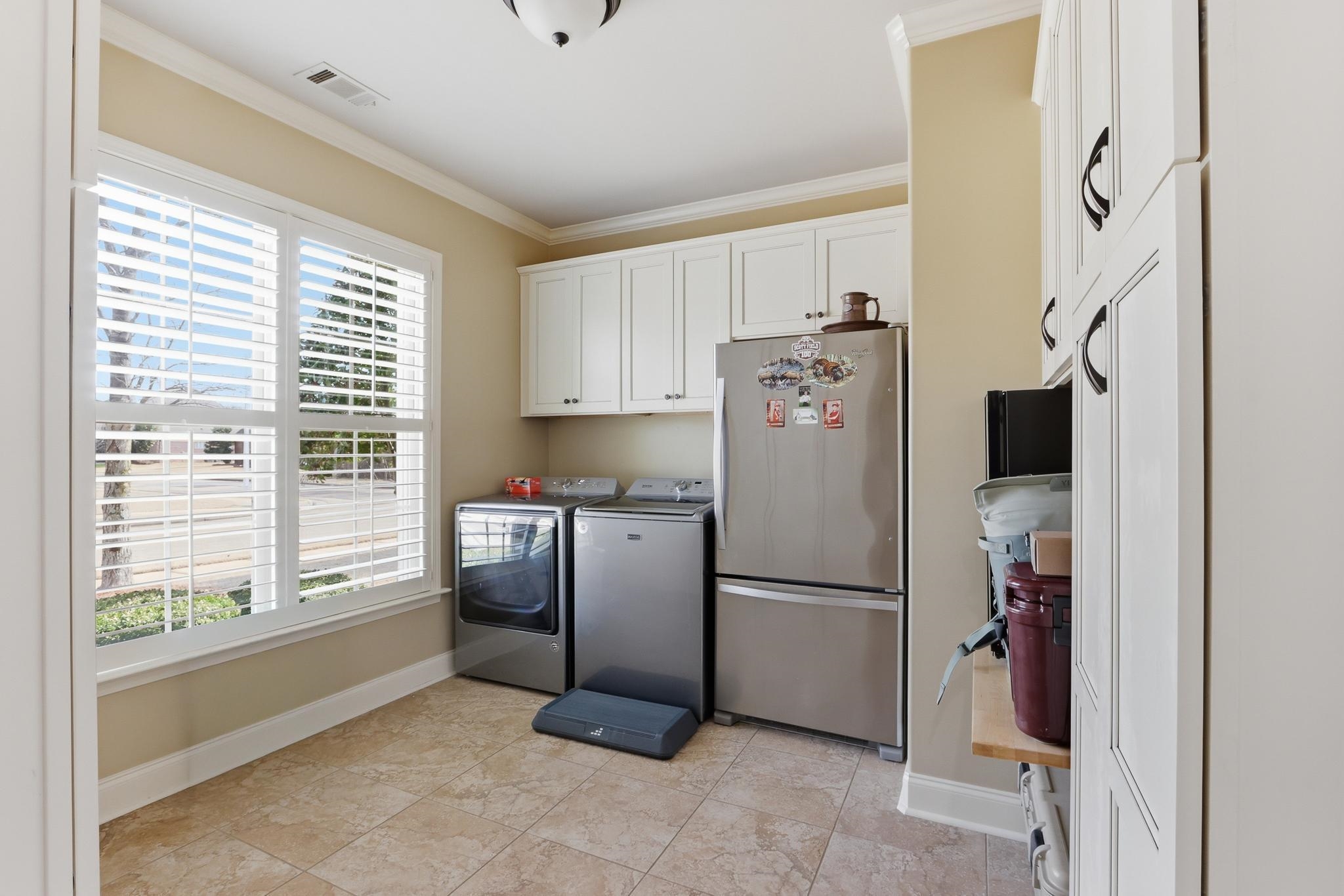 1301 Conser Street Collierville, TN 38017 - Photo 20 of 40 a kitchen with stainless steel appliances granite countertop a refrigerator and a stove