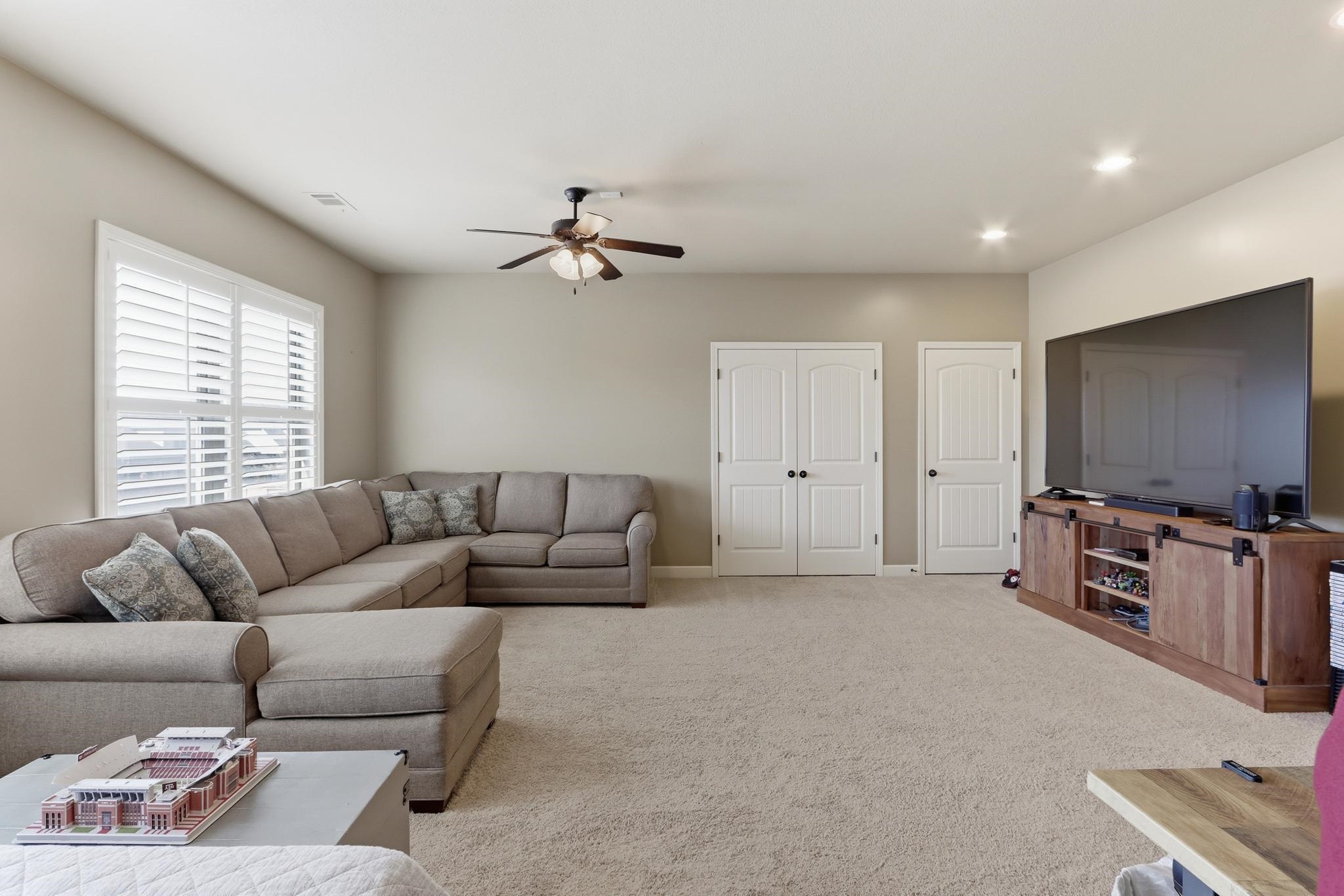 1301 Conser Street Collierville, TN 38017 - Photo 23 of 40 a living room with furniture and a flat screen tv
