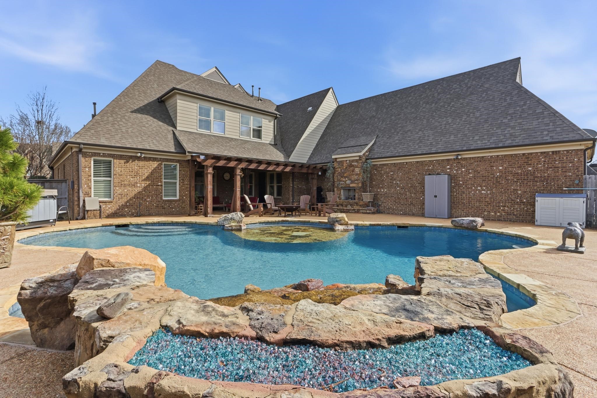 1301 Conser Street Collierville, TN 38017 - Photo 31 of 40 a view of a house with swimming pool and sitting area