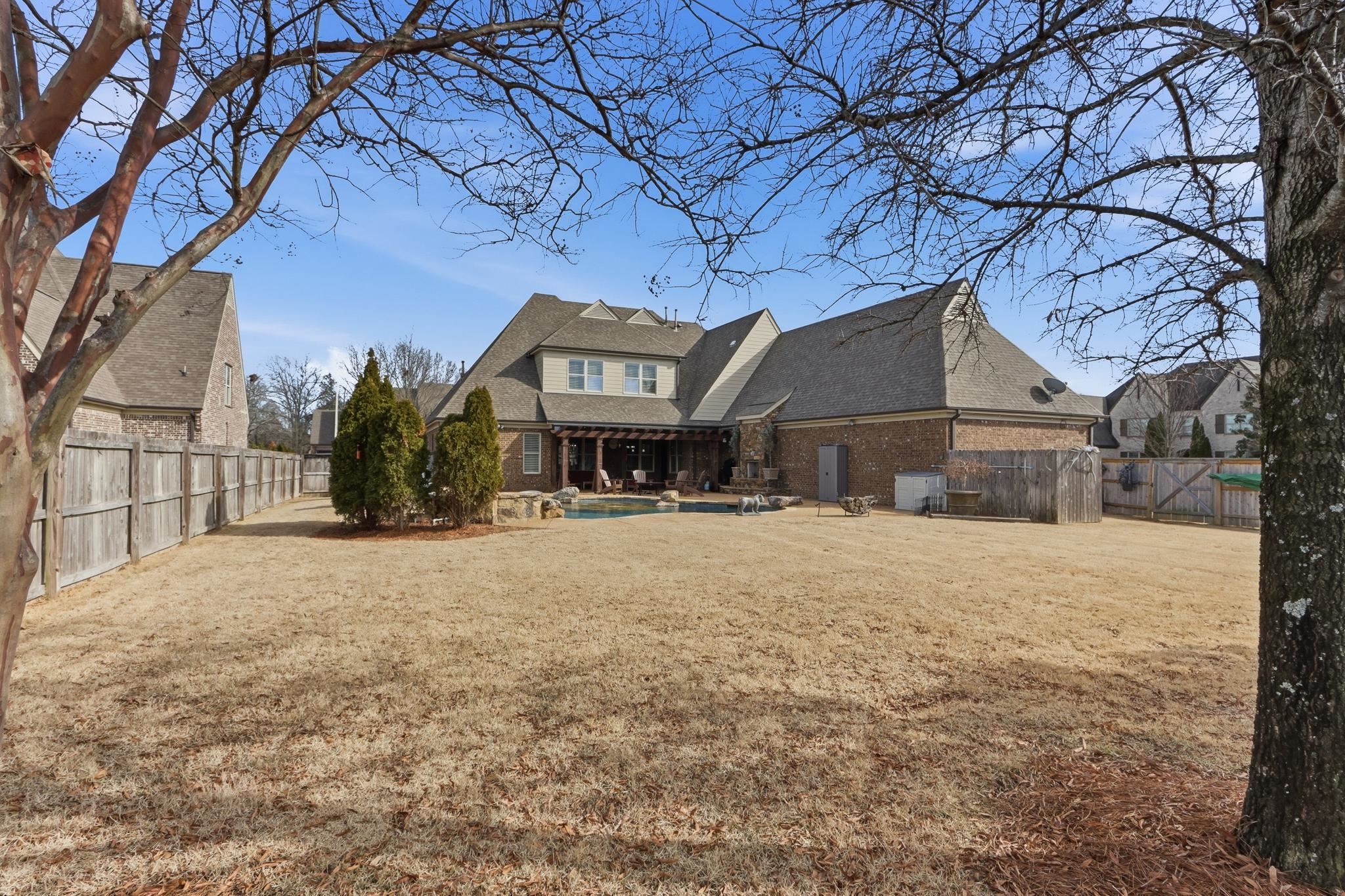 1301 Conser Street Collierville, TN 38017 - Photo 32 of 40 a front view of a house with a yard and garage