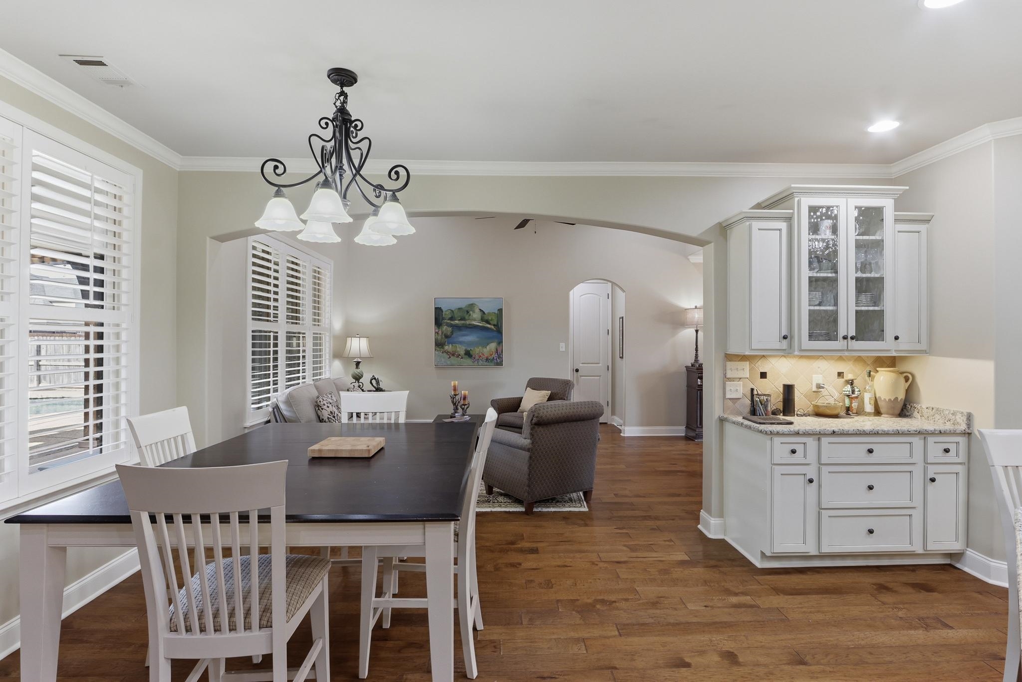 1301 Conser Street Collierville, TN 38017 - Photo 9 of 40 a view of a dining room with furniture and chandelier