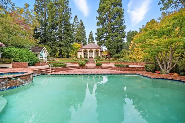 a kitchen with granite countertop stainless steel appliances and wooden cabinets