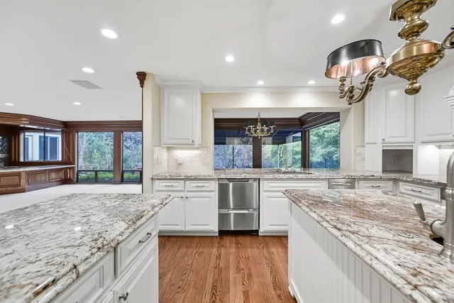 a utility room with sink dryer and washer