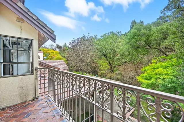 a view of a patio with table and chairs