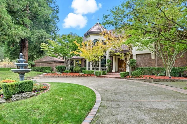 front view of a house with a garden