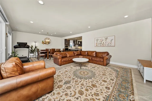 a living room with furniture and a rug