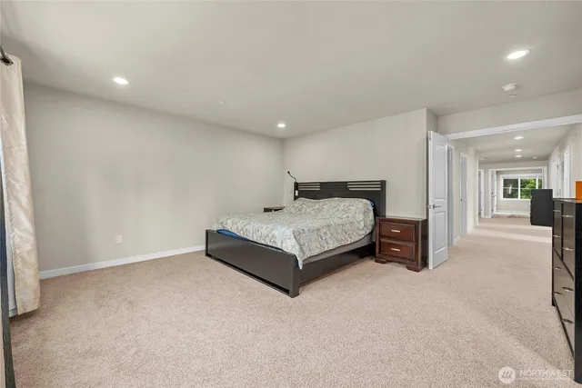 a room with a bed and lamp