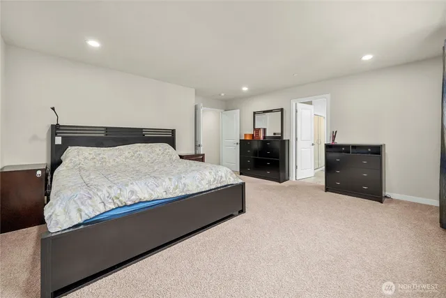 a bedroom with a bed and lamp