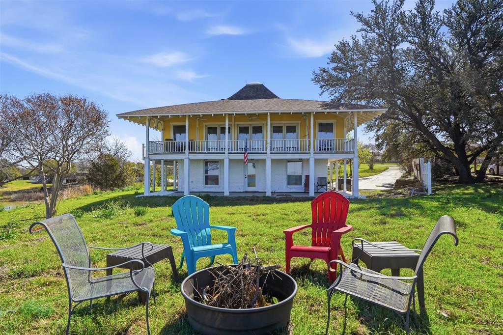 a front view of a house with garden and porch