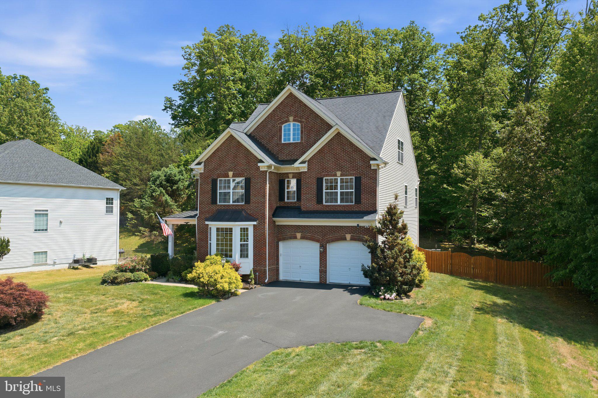 3679 Expedition Drive Triangle, VA 22172 - Photo 65 of 65 a front view of a house with garden