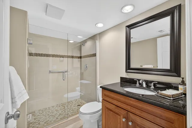 a bedroom with a bed a window and a flat screen television